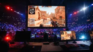 CS2 esports arena showing Anubis map on screen during intense 100 Thieves vs Falcons comeback match