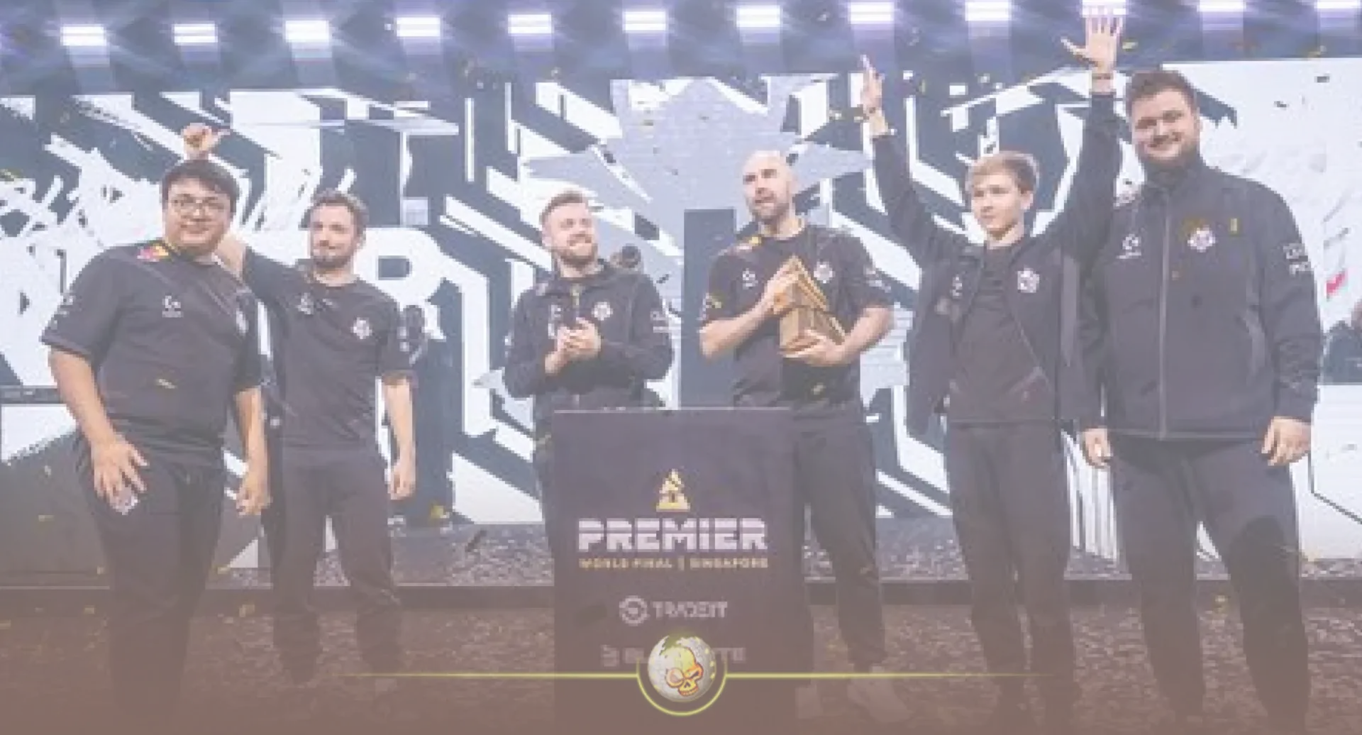 G2 Esports team members celebrating on stage with a trophy at the Premier World Final in Singapore.