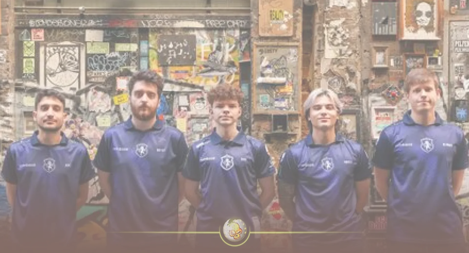 Team Liquid esports players in blue jerseys standing in front of a graffiti-covered wall.