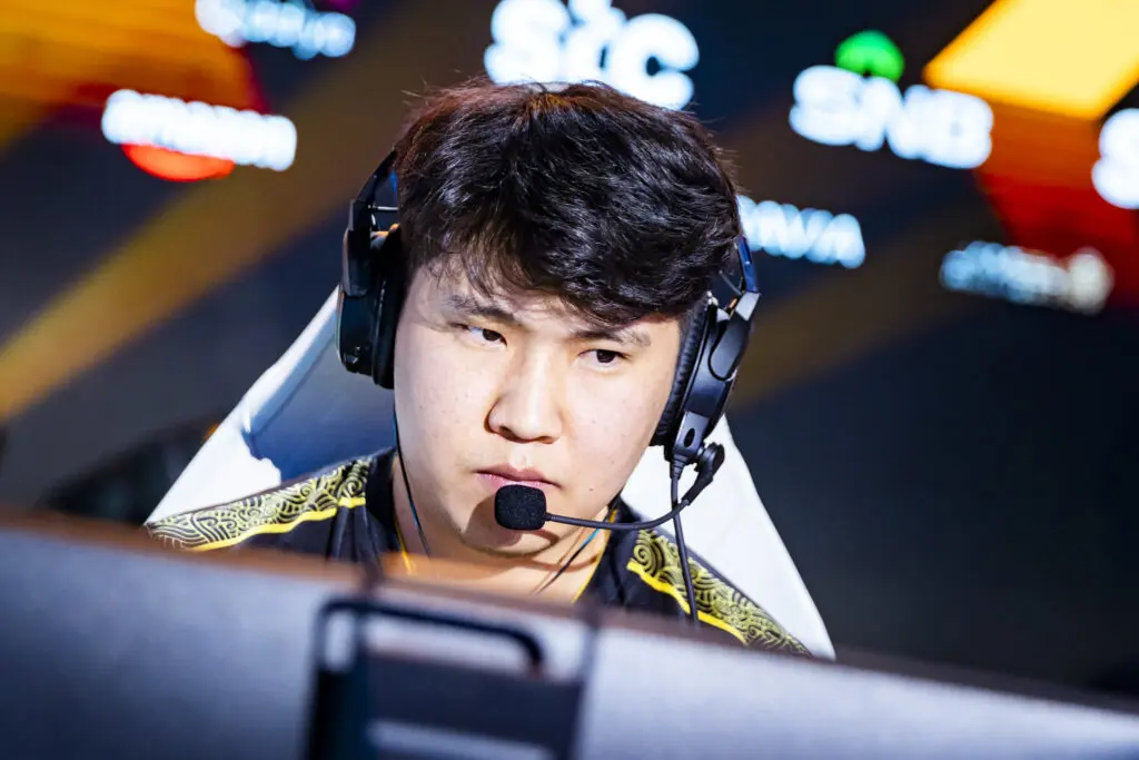 Close-up of professional gamer bLitz wearing a headset and team jersey during a match