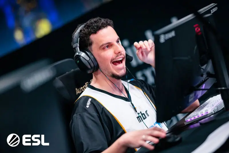 brnz4n wearing a MIBR jersey and gaming headset, smiling while playing at an ESL event