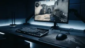 Professional CS2 gaming setup with blue accent lighting and competitive gameplay on monitor