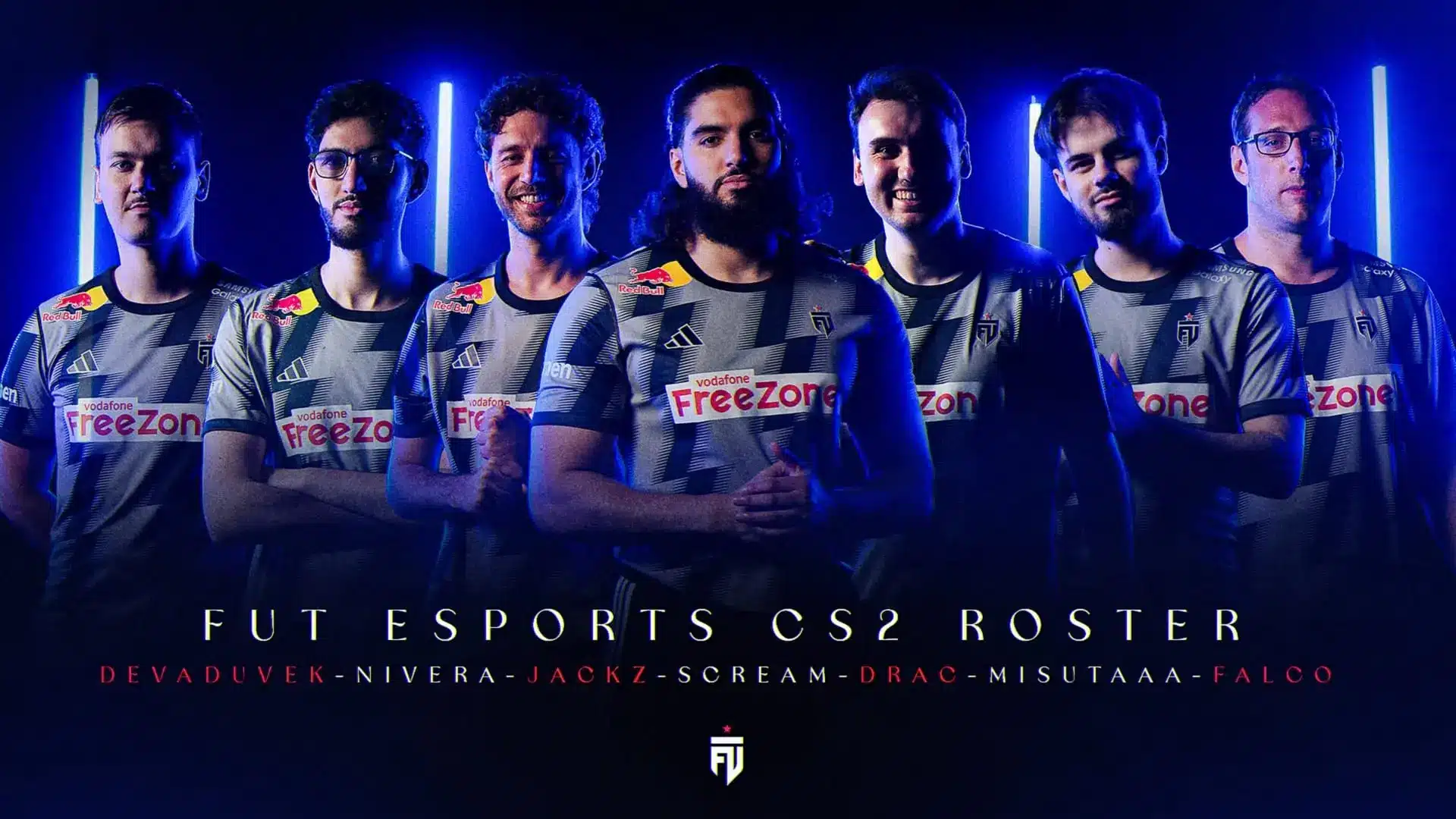 Group photo of seven FUT Esports CS2 players in team jerseys against a blue neon lit background