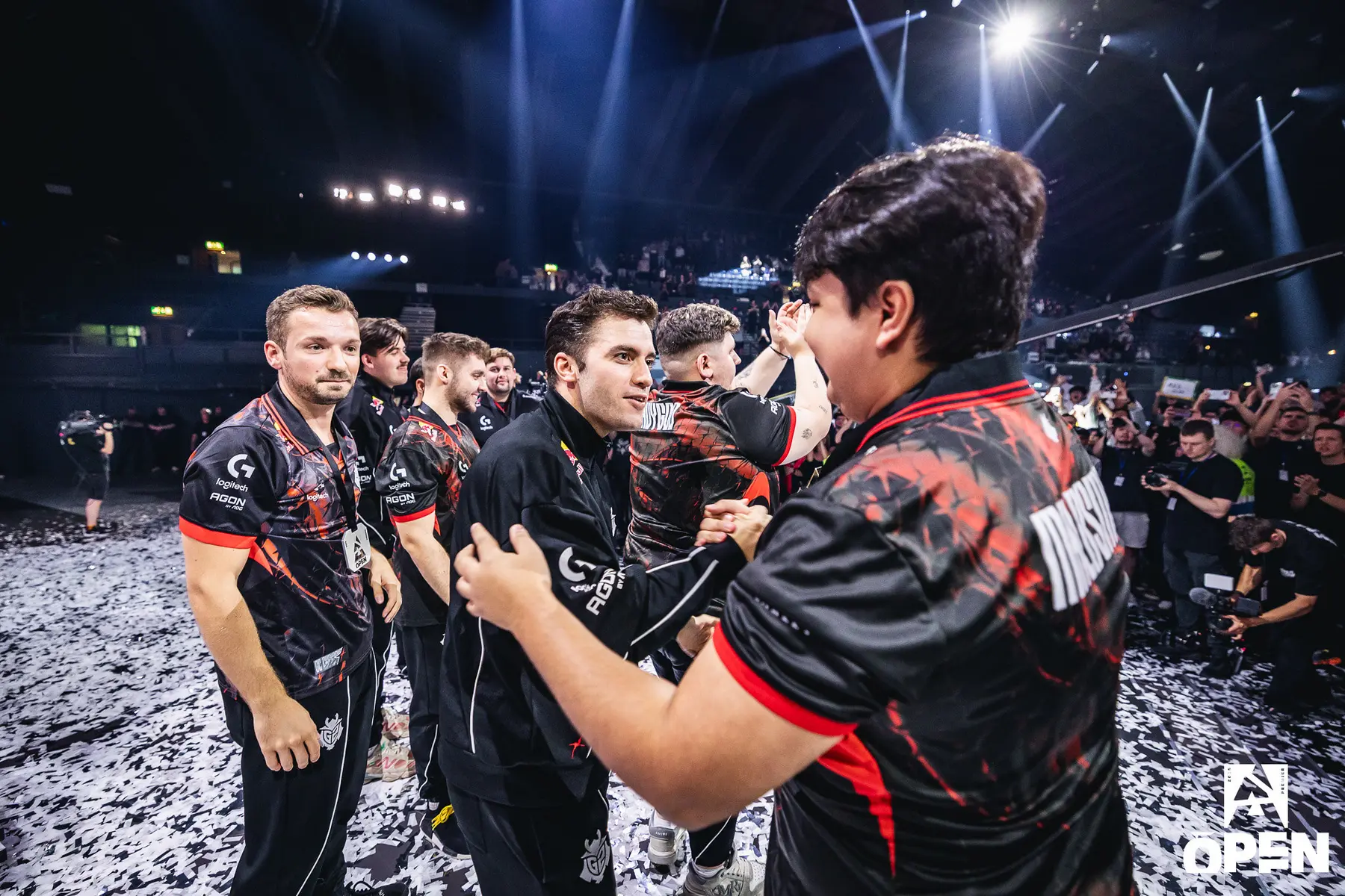 G2 Esports Counter-Strike team members in black and red jerseys celebrating on a tournament stage.
