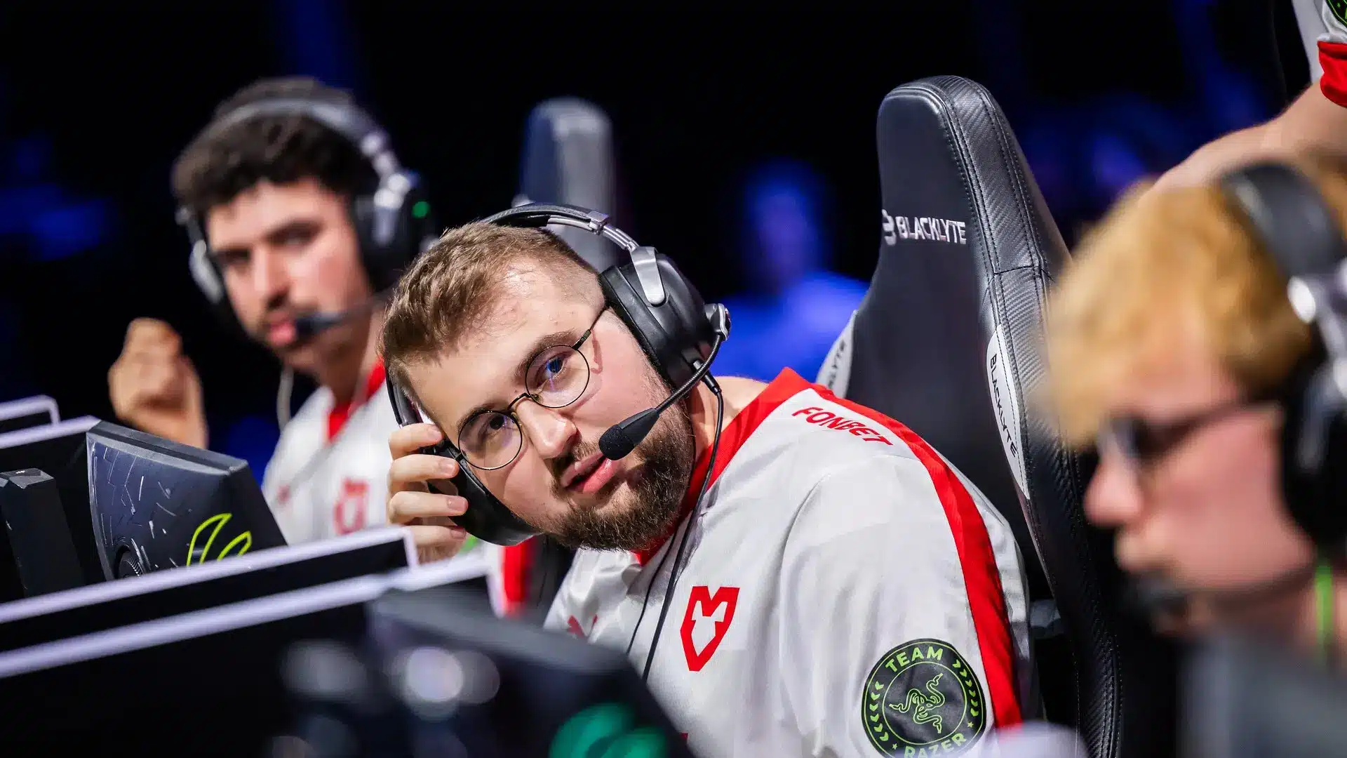 MOUZ CS2 esports players wearing team jerseys and headsets at a competitive gaming event