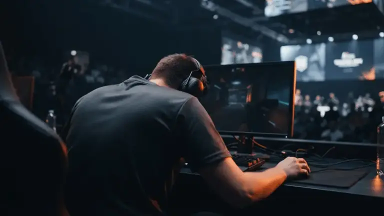 Anonymous esports player at a gaming rig after Aurora’s decisive Counter-Strike win over NAVI