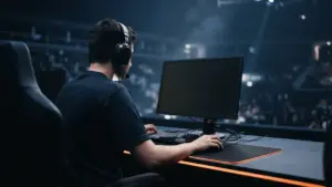 Anonymous esports player competing under orange arena lights at a major Counter-Strike tournament
